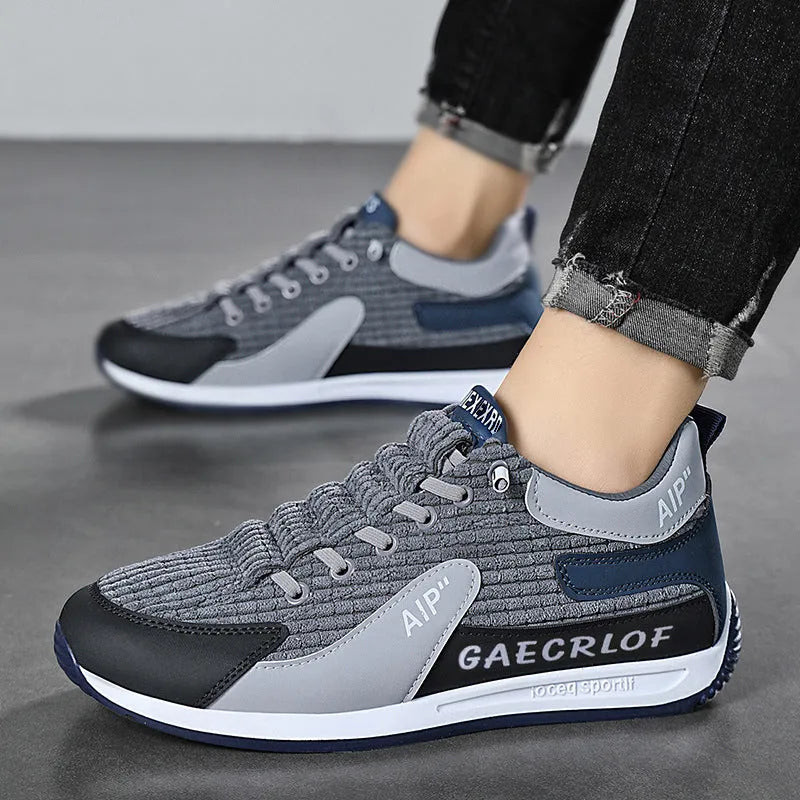 Men's grey and green mesh running shoes with lace-up front and low-top design