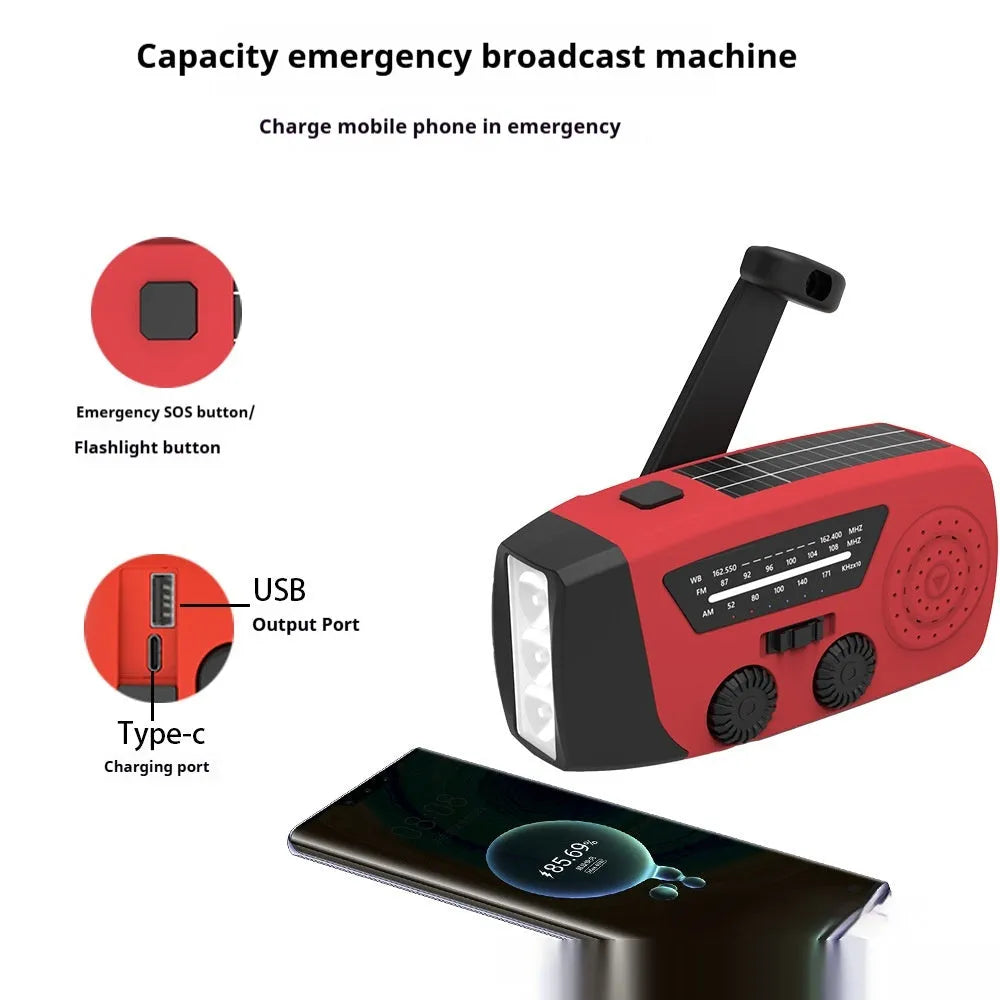 Red rechargeable emergency hand radio and torch with USB port, wrist strap, and display screen.