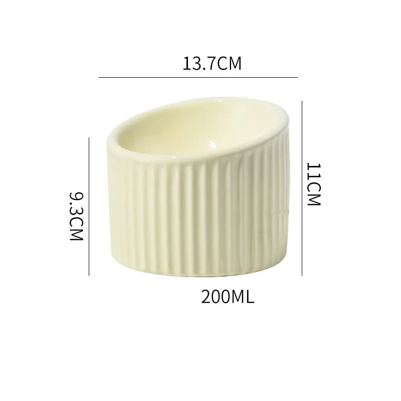Elevated ceramic cat bowl in green colour showing raised, tilted design for food or water.