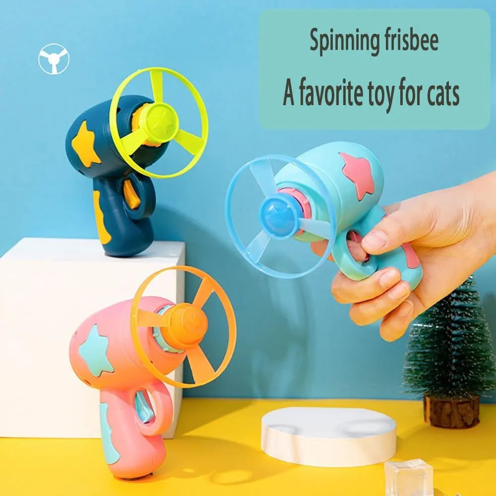 Blue or pink plastic cat toy gun with frisbee, showing compact size for indoor cat play.