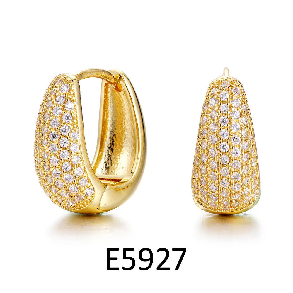 Heart-shaped copper ear clip earrings with brass gold plating and gang drill elements
