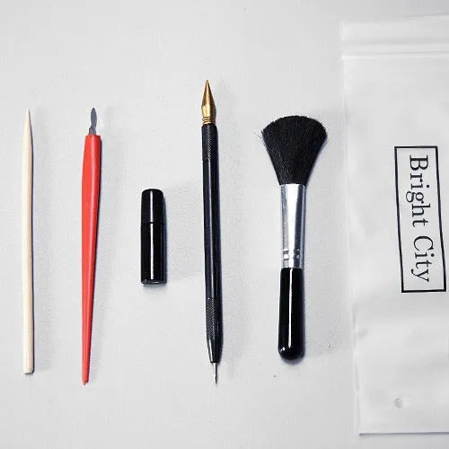 Scratch painting art tool kit containing healing pen, scratch pen, scraper, brush, and spray paint in a gift bag.