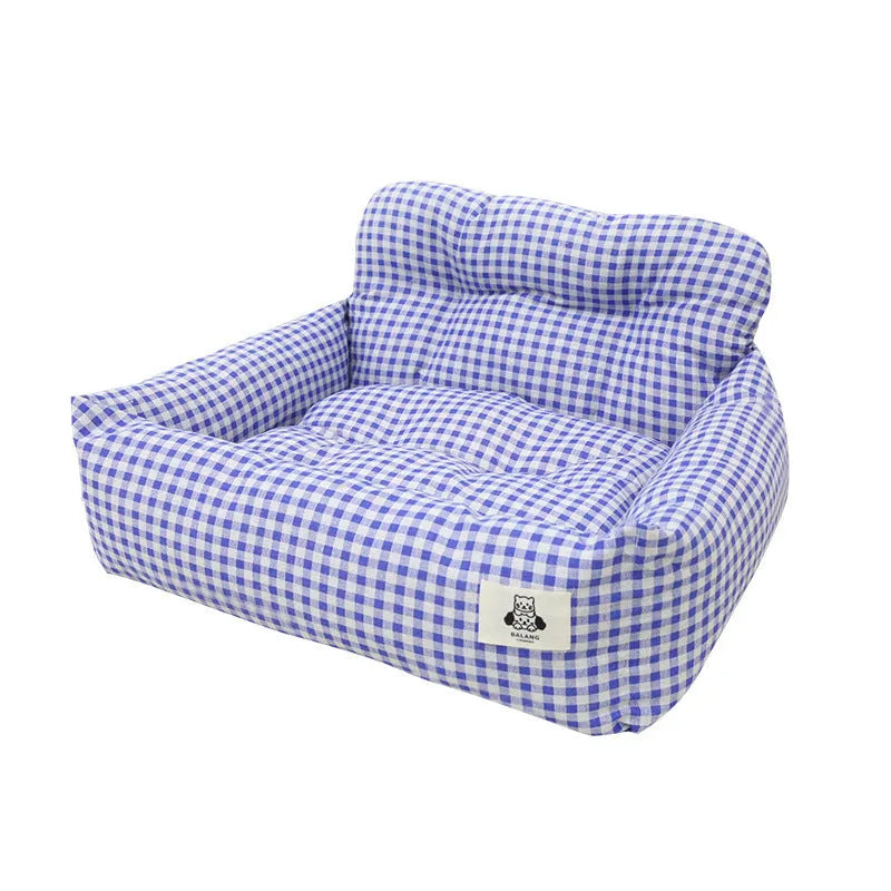 Car-mounted pet outing nest in stain-resistant cloth showing grey and blue plaid colour options