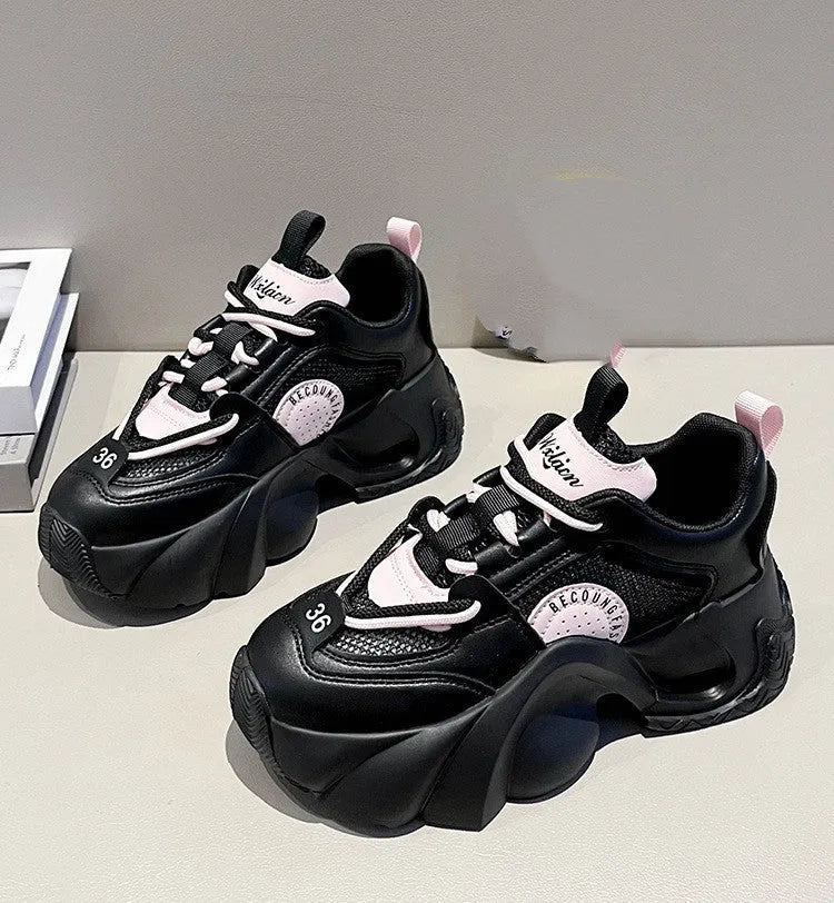 Women's pink thick sole sneakers with cross straps and breathable mesh lining on a white background.