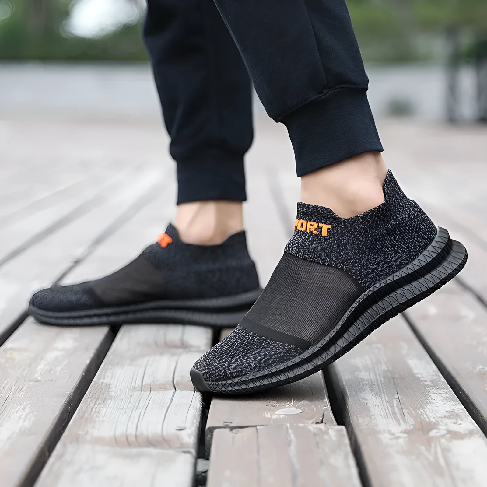 Casual grey Flyknit sock shoes with laces and a low-top MD sole, shown on a foot.