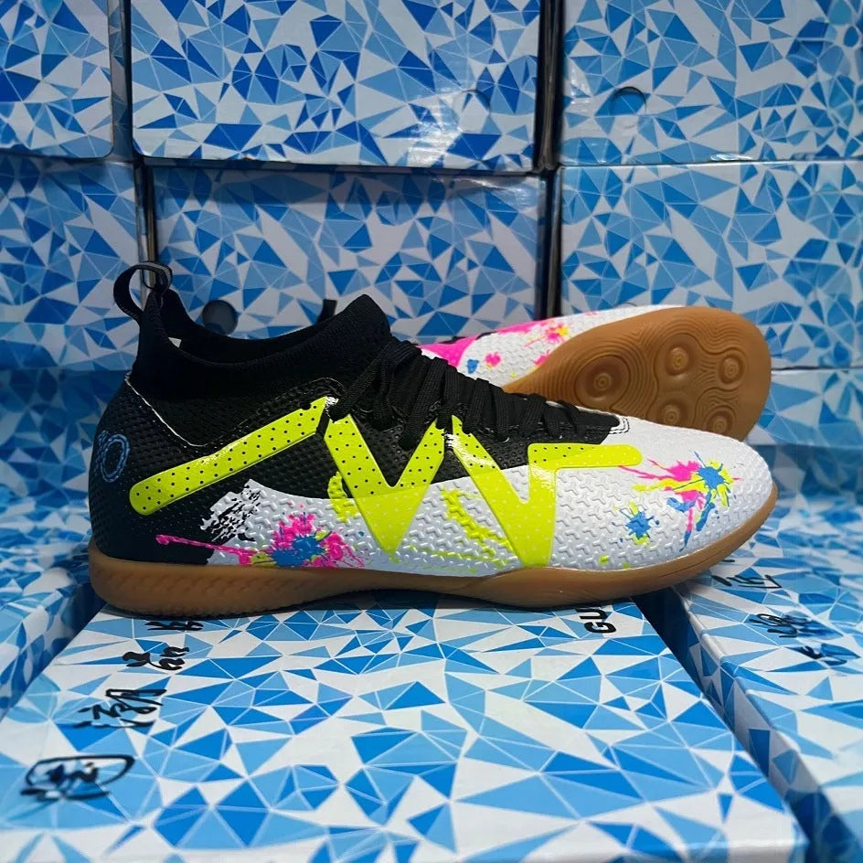 Adult football boots with non-slip rubber outsoles in black and yellow colourway