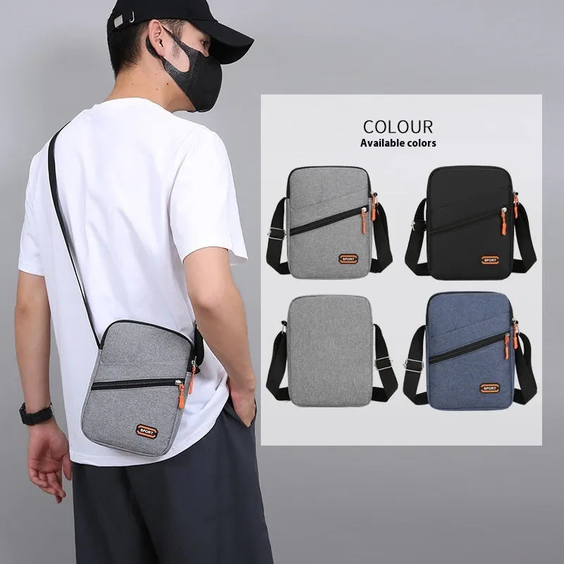Solid colour Oxford cloth crossbody commuter bag with contrast details in silver grey.