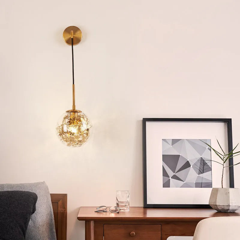 Glass wall lamp with floral pattern in choice of golden or silver finish
