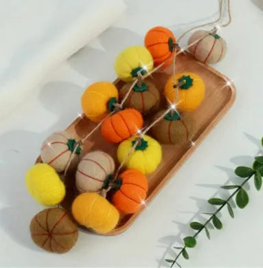Wool felt pumpkin ornament measuring 5cm diameter in autumn colours for miniature displays