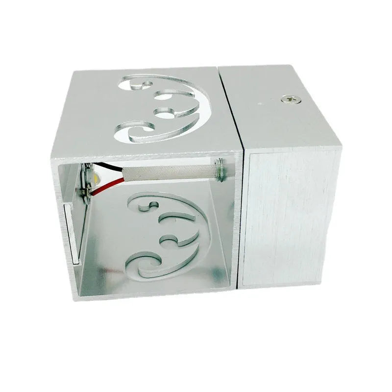 Modern aluminium butterfly-shaped LED wall lamp with multi-colour remote control.