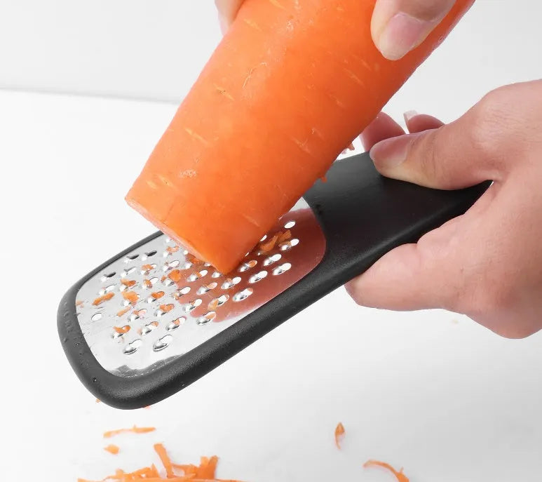 Six kitchen gadgets with brush in stacking configuration showing stainless steel and plastic components