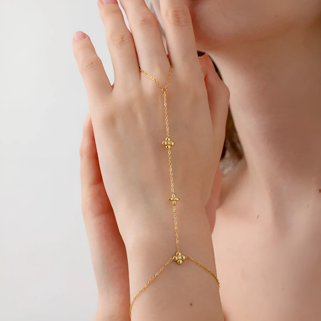 Women's gold stainless steel bracelet with geometric eight-pointed star and flower designs