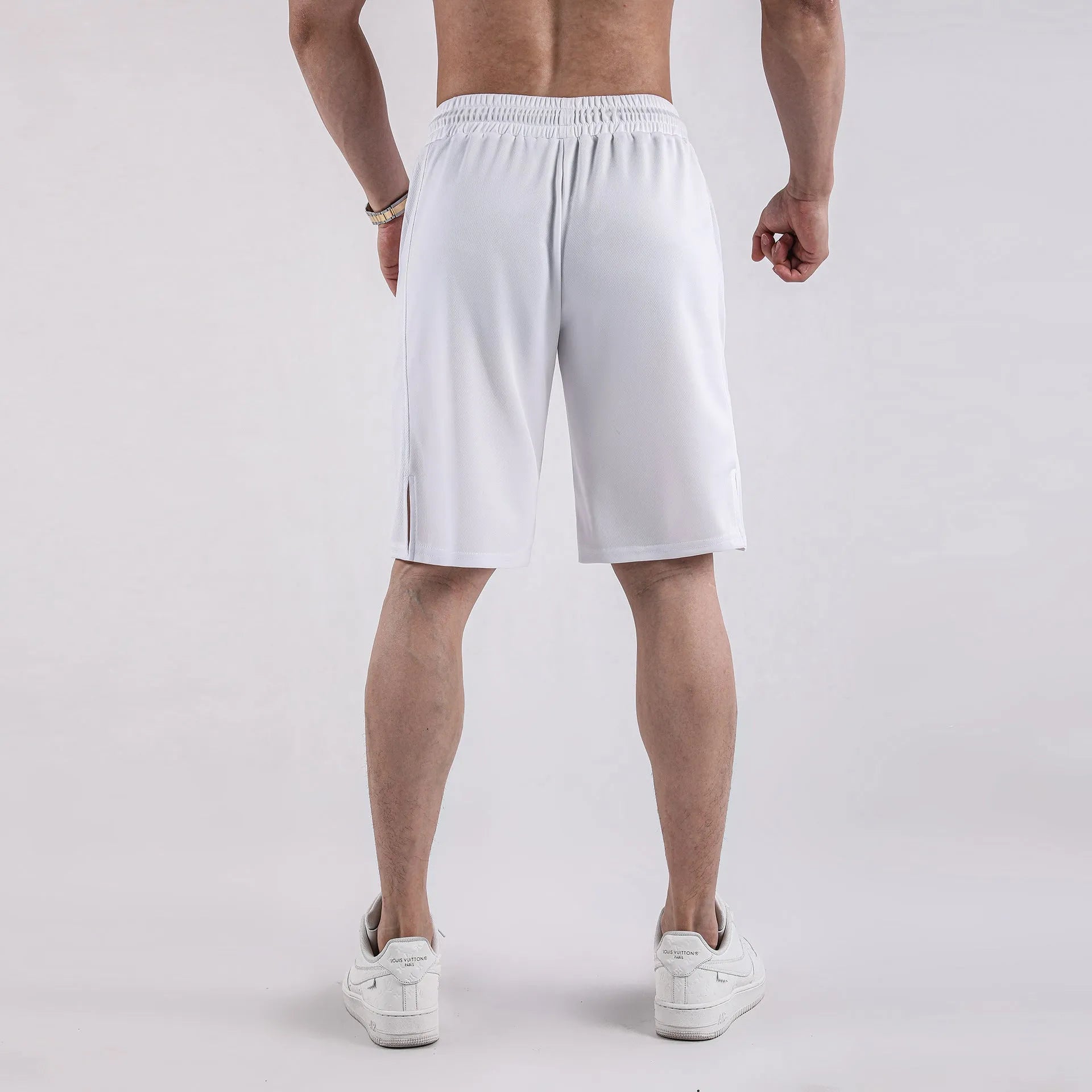 Men's black quick-dry mesh shorts with elastic waist, shown in a loose, casual fit.