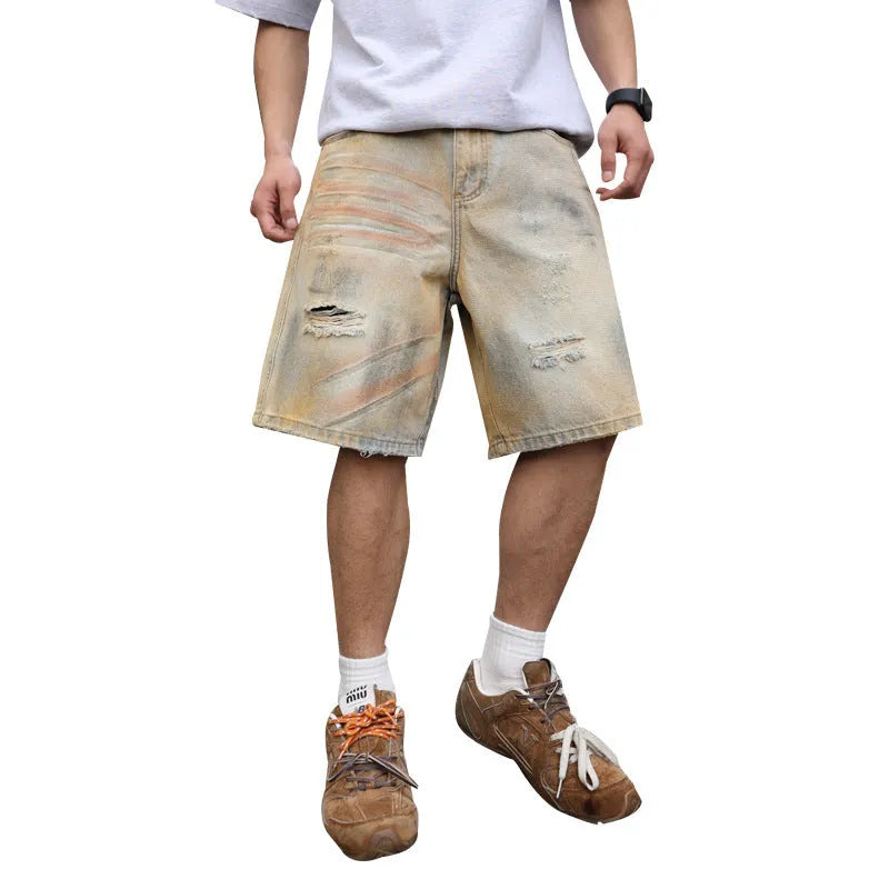 Light blue washed men's denim shorts with ripped details on a straight-leg cut
