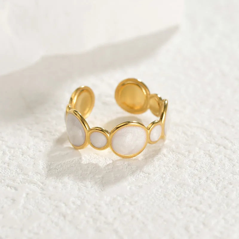 Simple stainless steel geometric ring for women with an adjustable opening.