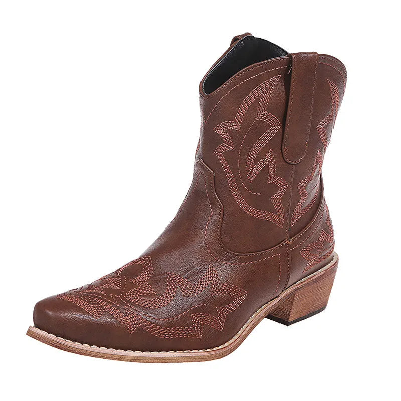Women's blue embroidered cowboy boots with low chunky heel and pointed toe.