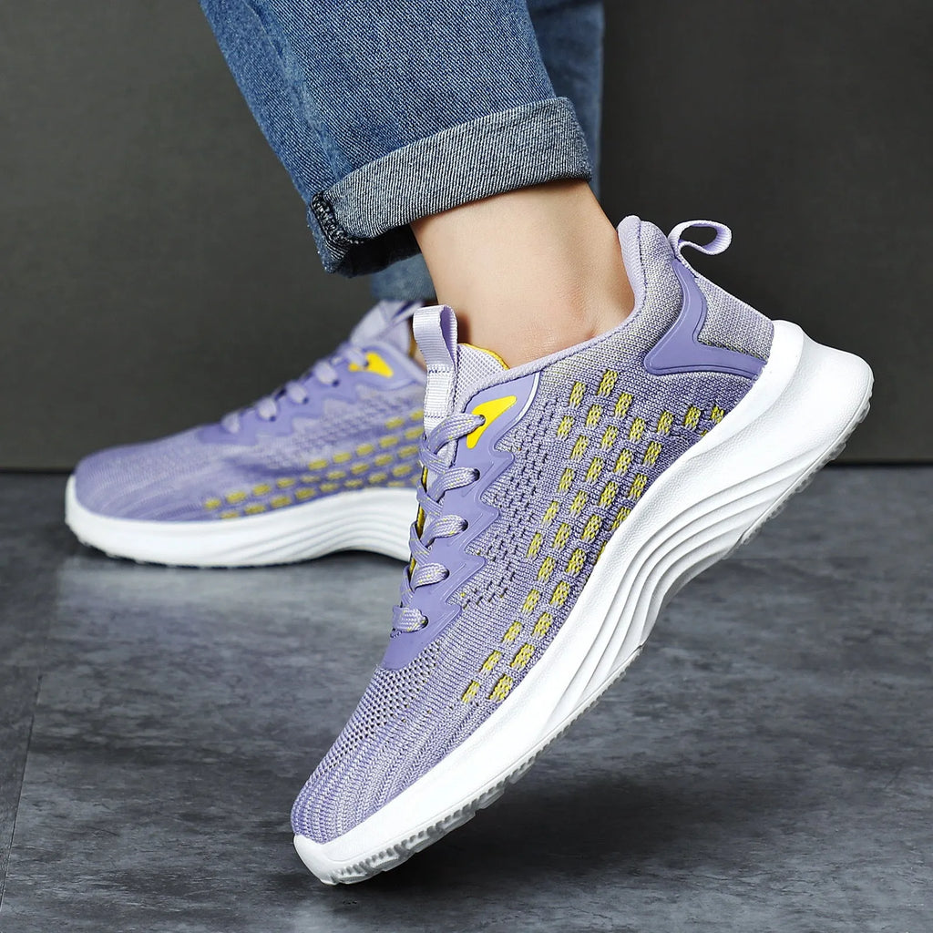 Women's lavender purple Flyknit running shoes with mesh lining and striped pattern for athletic use