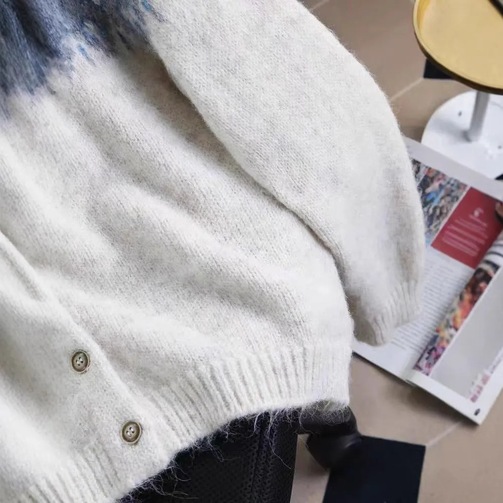 Women's loose-fit jacquard knit sweater coat in milky white, shown with long sleeves and textured pattern.