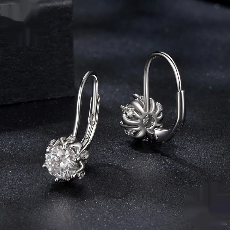 White gold plated sterling silver flower bud clip earrings with a moissanite centre stone