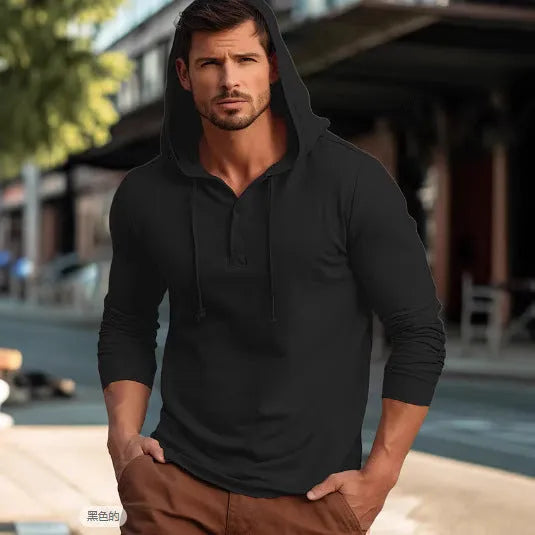 Man wearing a dark blue casual cotton hoodie pullover with long sleeves.