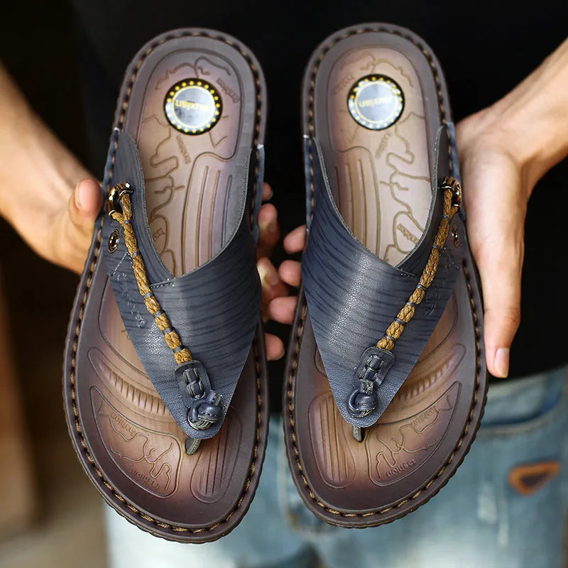 Men's dark blue herringbone pattern outdoor slippers with leather lining and rubber sole, shown in a large size