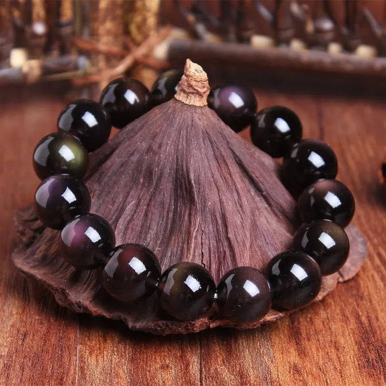 Geometric Pi Xiu charm on a polished icy obsidian crystal bracelet for men and women.
