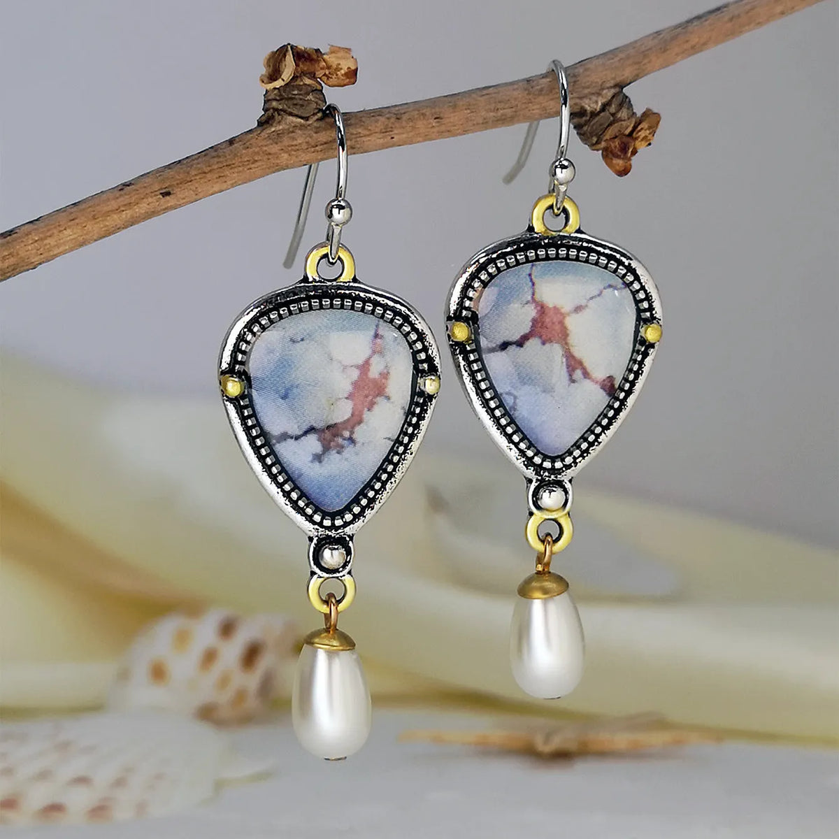 Retro blue drop earrings with geometric design featuring synthetic opal and pearl details