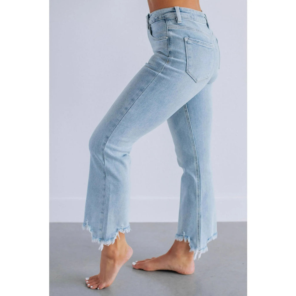 Women's solid colour denim jeans with a hand-worn finish in dark blue and light blue options.