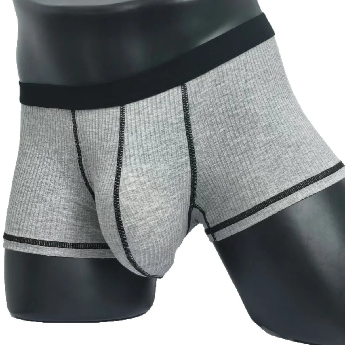 Men's solid-colour fibre boxer shorts on a white background showing hip-lifting design.