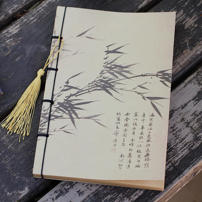 A5 antique wire-bound notebook with retro painting cover, thread binding, and black tassels.