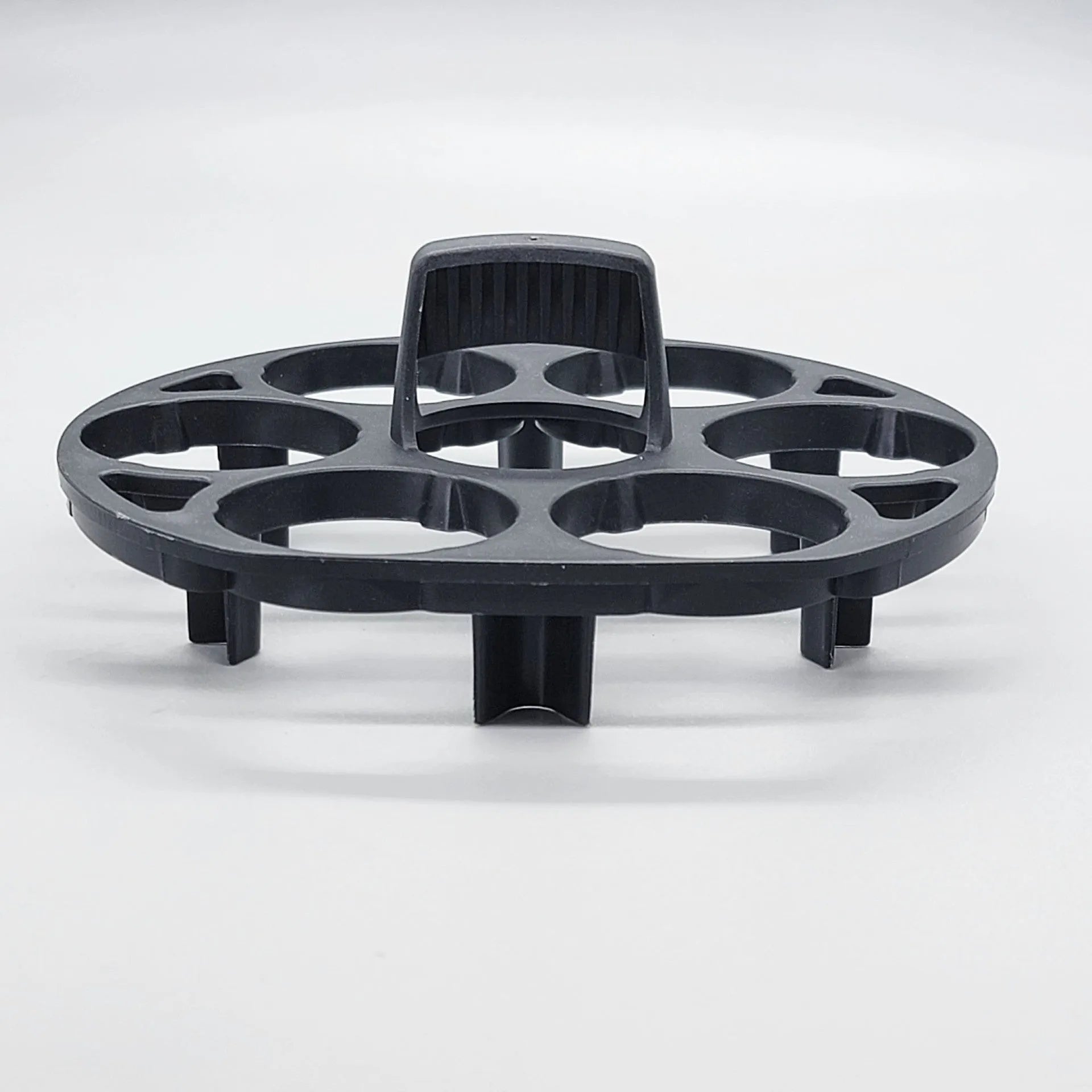 Black plastic egg holder with retainer design for kitchen storage, measuring 13.8cm by 12.6cm