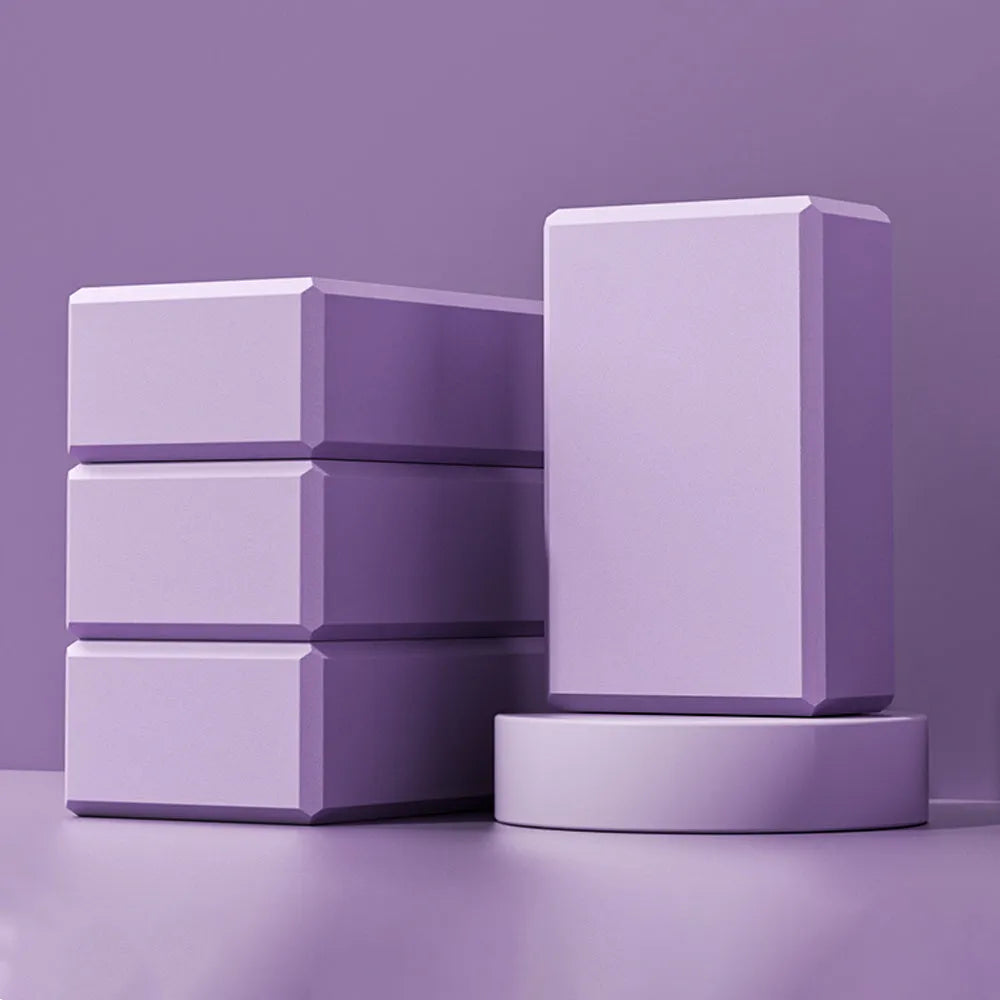 Solid colour EVA foam yoga block with ridged surface, measuring 23cm long
