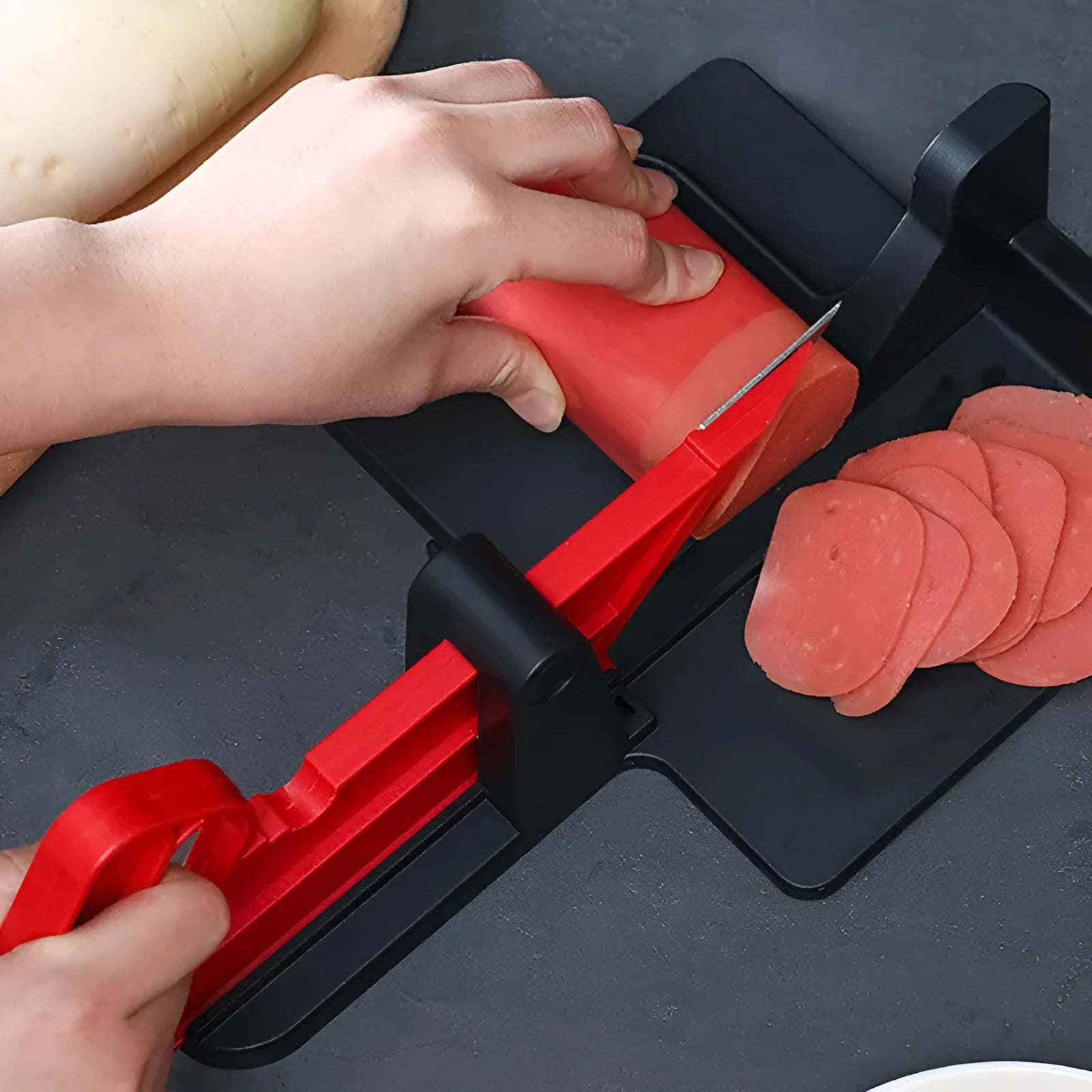 Green and red modern vegetable cutter with stainless steel blades for slicing carrots and potatoes