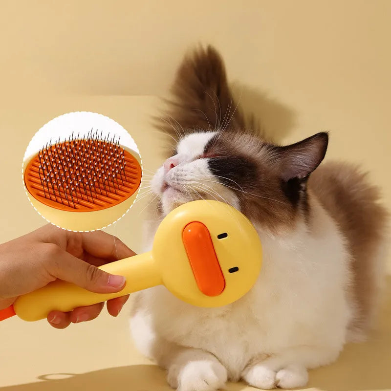Small yellow duck-shaped pet grooming comb with stainless steel needles
