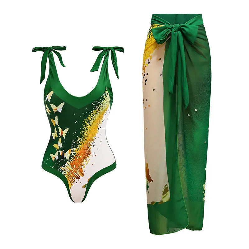 Women's solid colour one-piece swimsuit with thin spaghetti straps and a matching detachable skirt.