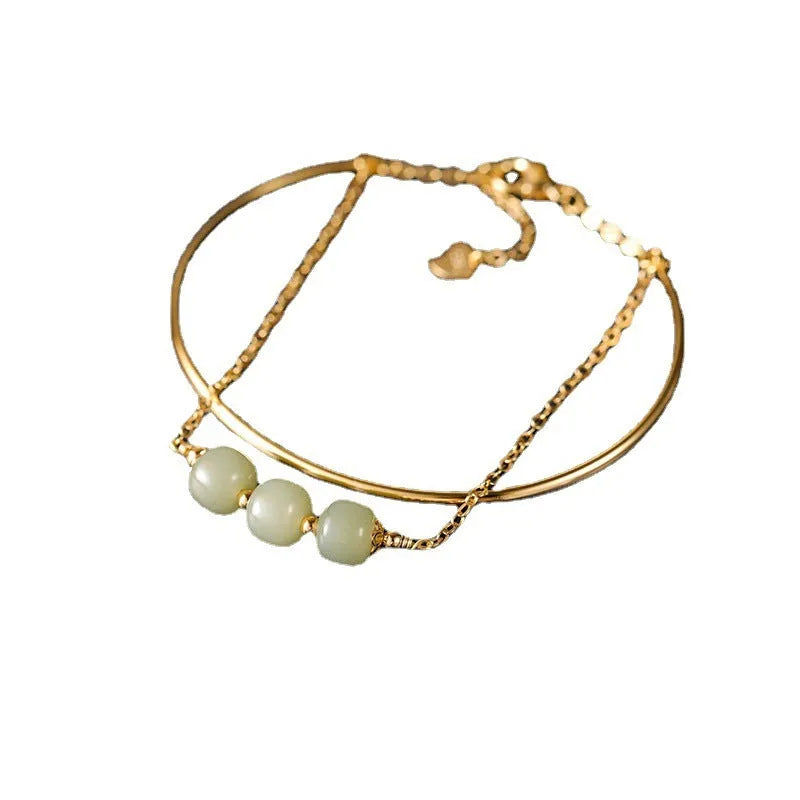 Women's jade lucky beads bracelet with gold inlay, showing single, double, and three bead version options.