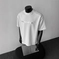 Men's cotton short sleeve T-shirt with loose fit and letter pattern in summer casual styling