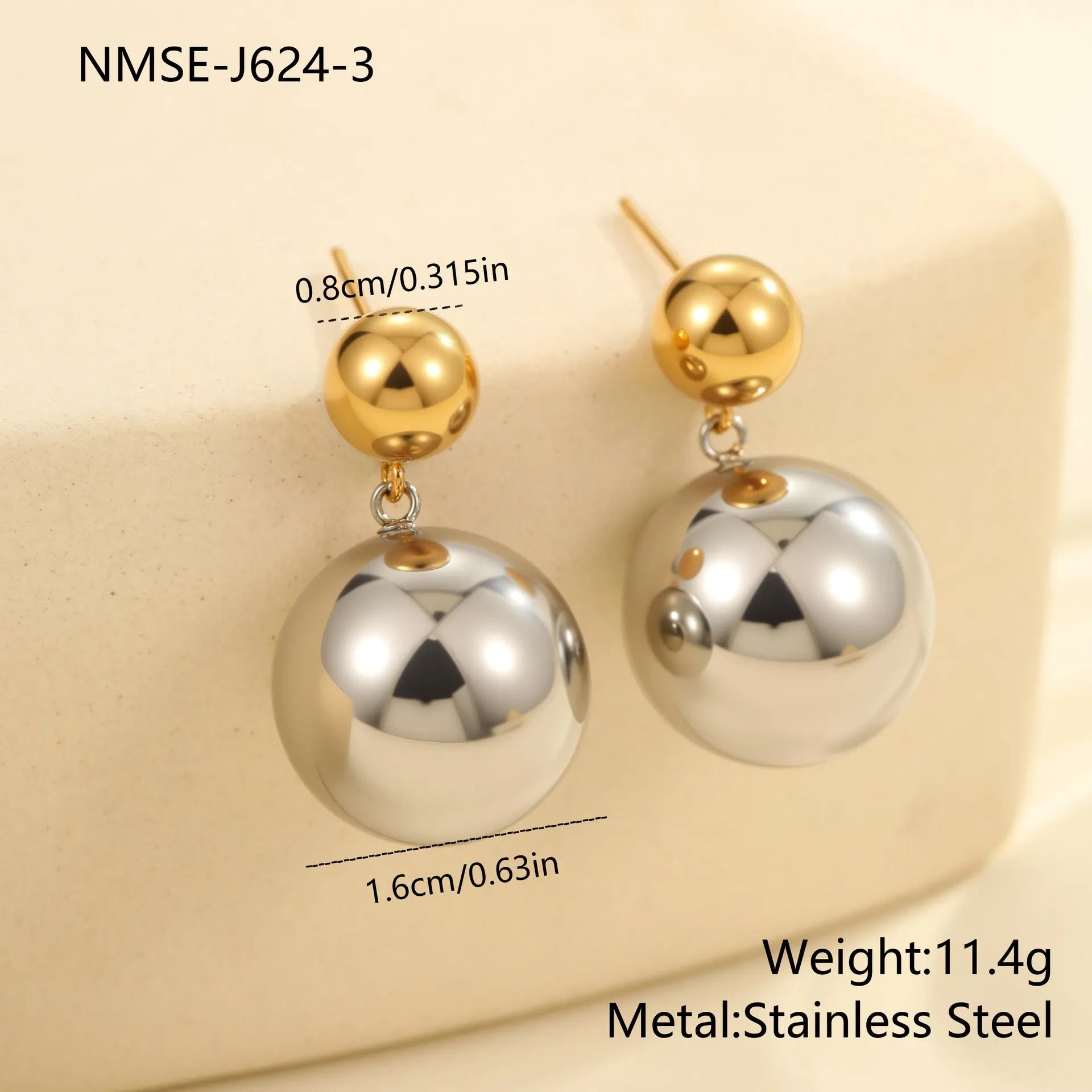 A pair of stainless steel colour-block ear studs with round beads and an 18K gold electroplated finish.
