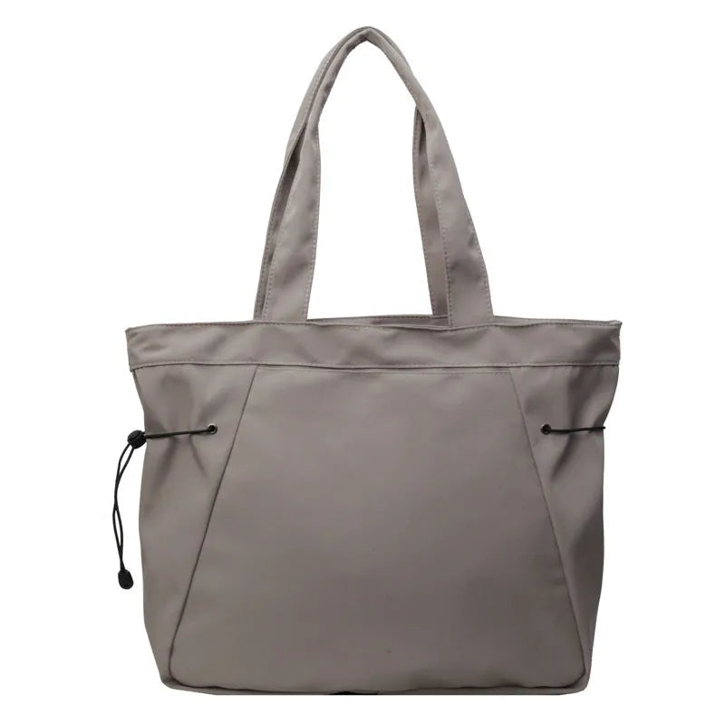 Soft foldable Oxford cloth commuter shoulder tote bag in street trend style.