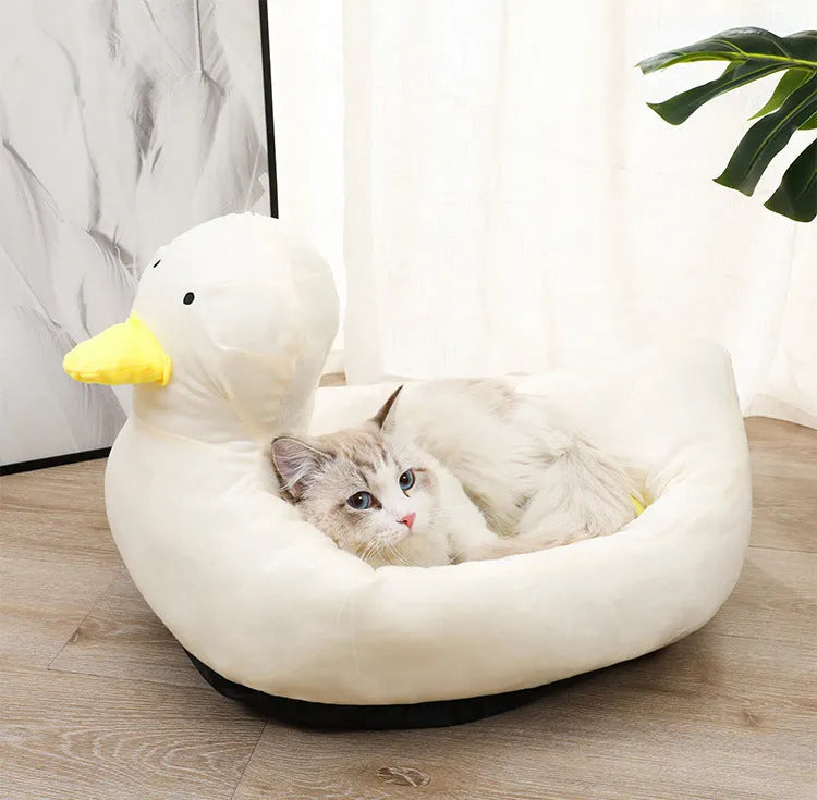 Duck-shaped fluffy pet bed for small dogs and cats in blue or white