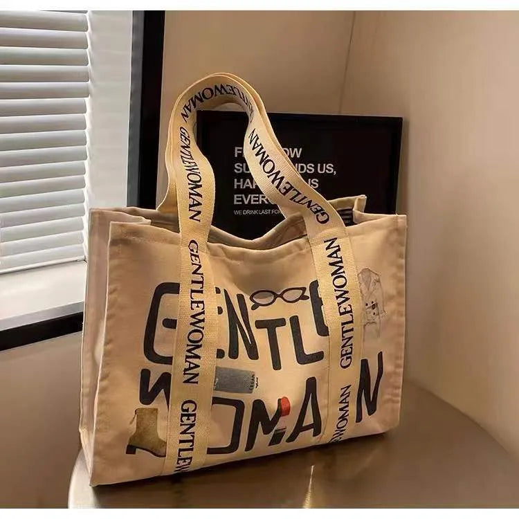 Large canvas tote bag with printing detail in black letters, coloured letters, or pattern style variations