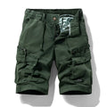 Men's army green cotton shorts with zipper and multiple pockets, shown on a hanger.