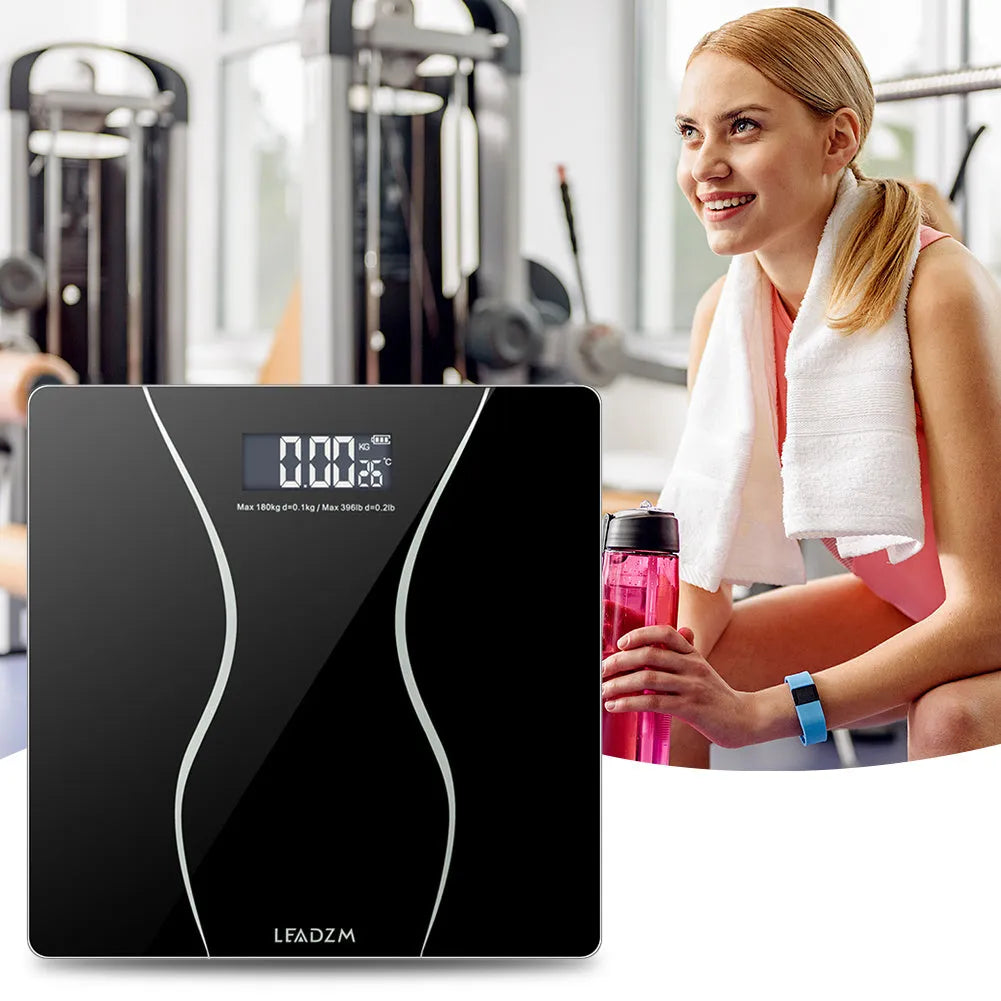 Black electronic bathroom scale with digital display for weight measurement up to 180kg