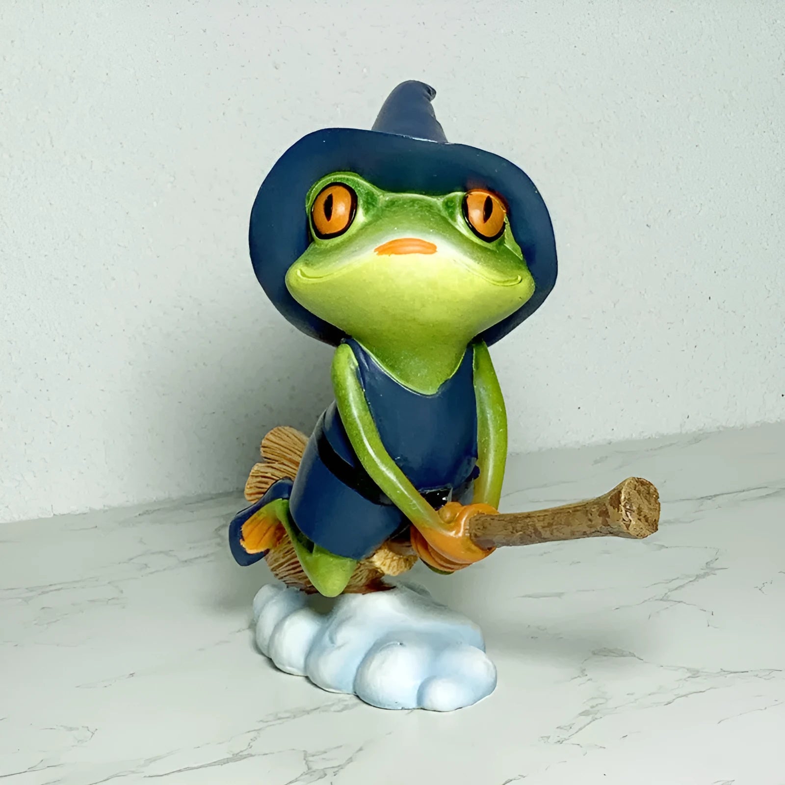 European style Magic Yoga Frog plastic resin ornament in RDW123 colour on a tabletop.