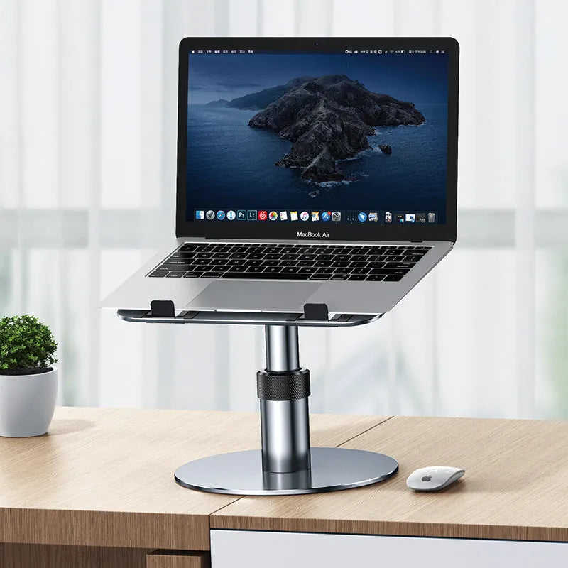 Silver aluminium car laptop stand with adjustable height and 360-degree rotating base on a car seat.