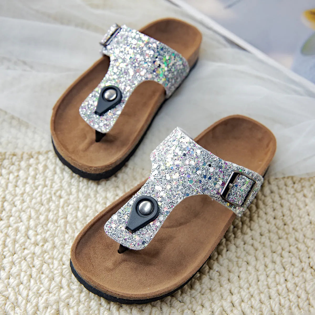 Children's cork flip-flops in gold with a hollow-out design and PVC sole.