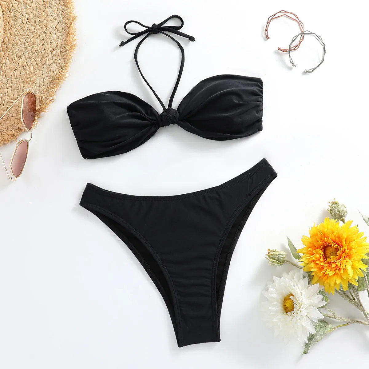 Black women's lace-up tube top bikini set with separate briefs in polyester swimwear fabric.