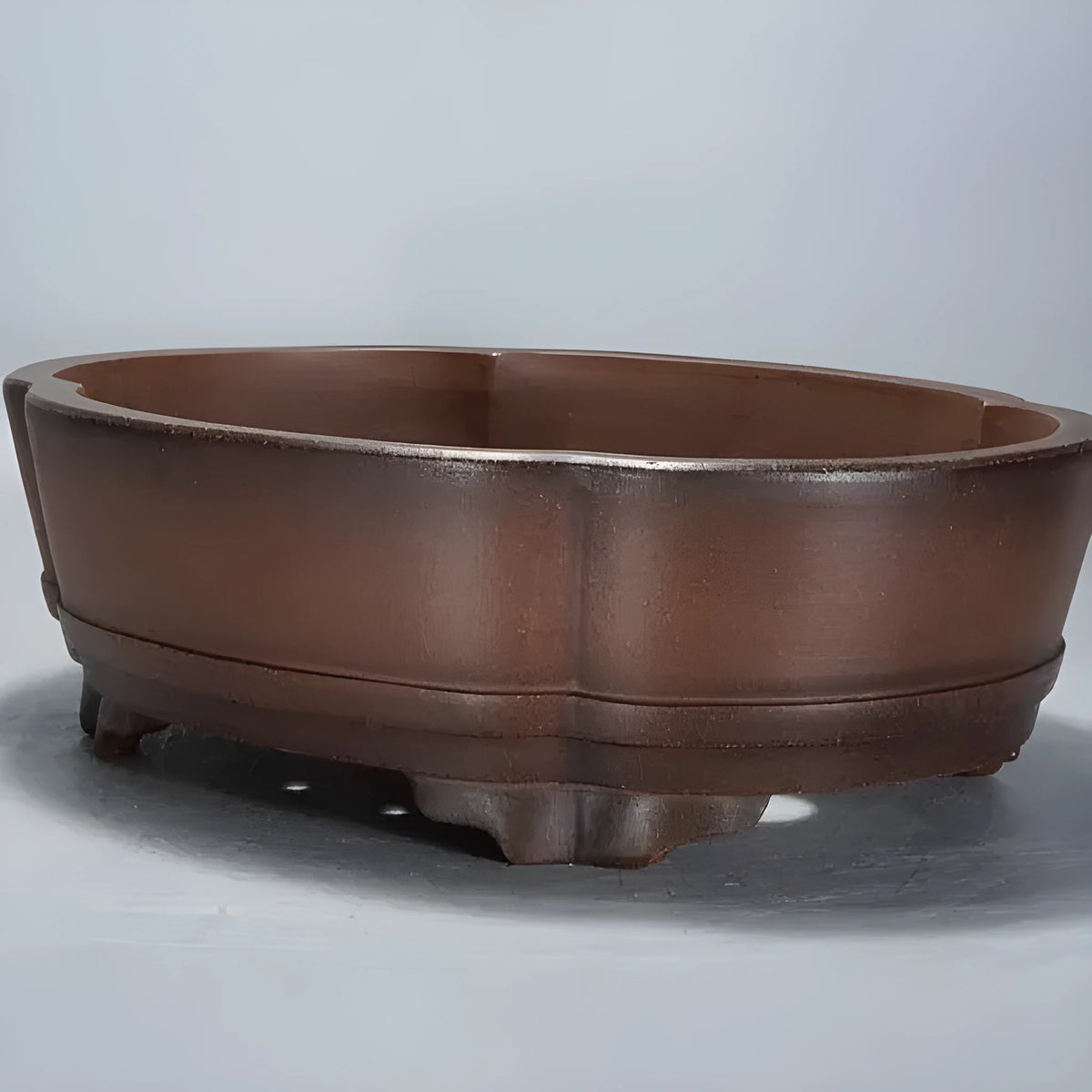 A classical style purple clay bonsai flower pot with simple design.