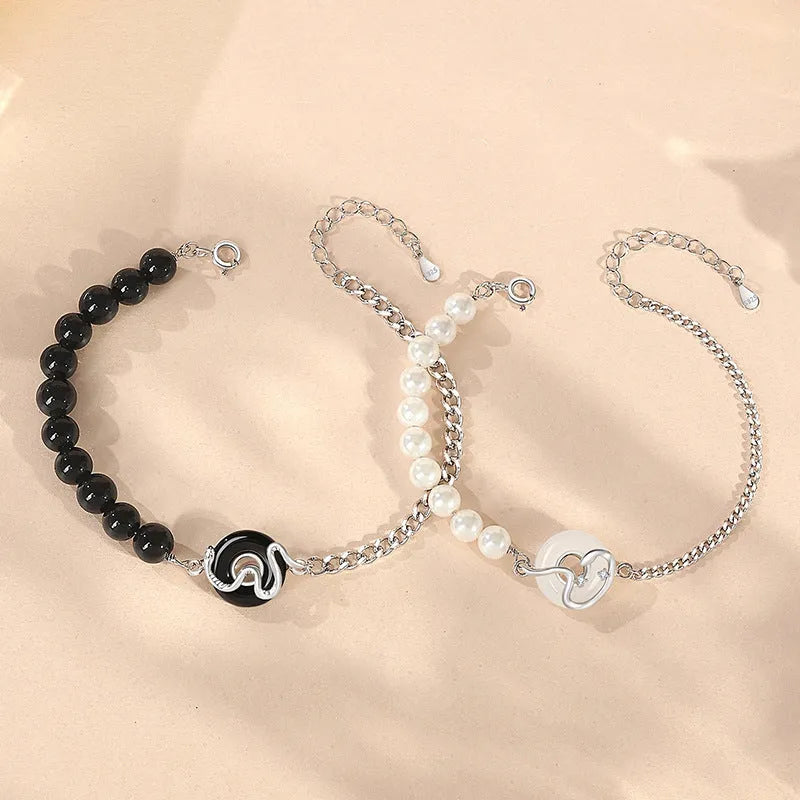 925 sterling silver couple bracelet with snake charm, obsidian pearl, and safe buckle in new Chinese style.