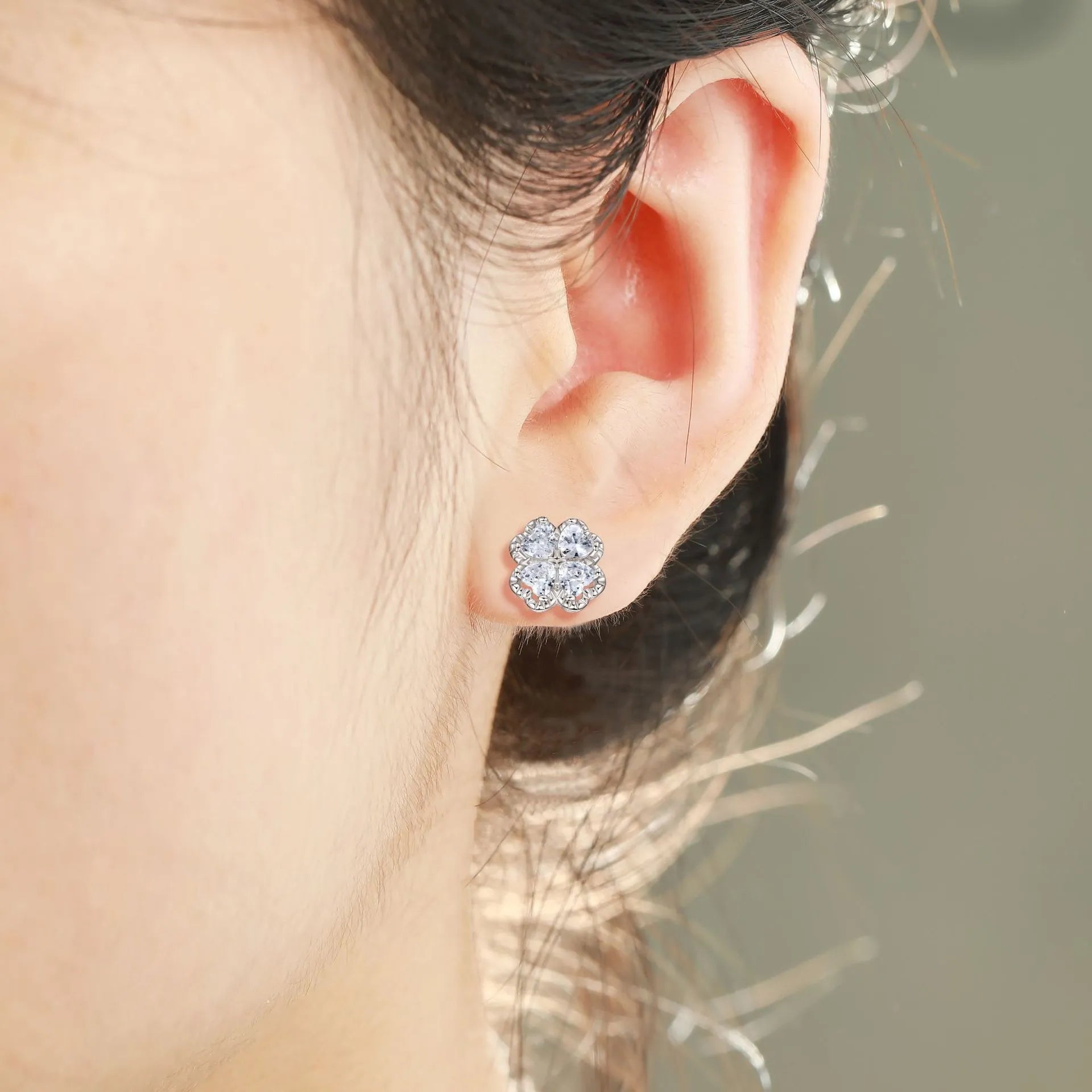 Pair of 925 silver heart-shaped earrings with inlaid zircon stones and a white gold colour finish.
